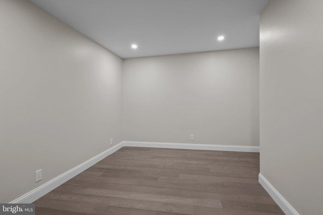 unfurnished room with hardwood / wood-style floors