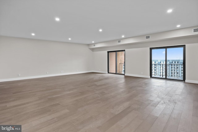 unfurnished room with light hardwood / wood-style flooring