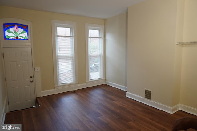 entrance foyer featuring dark hardwood / wood-style floors