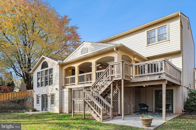 back of house with a patio area, ceiling fan, a yard, and a deck