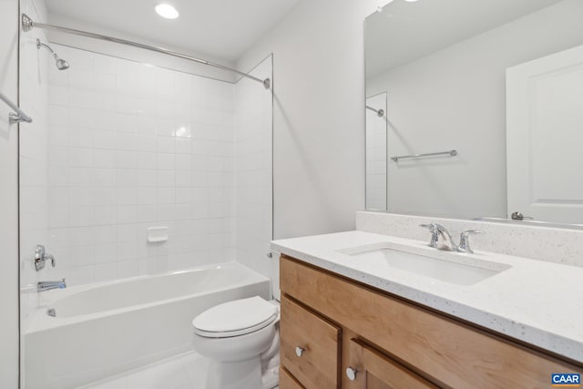 full bathroom featuring tile patterned floors, vanity, toilet, and tiled shower / bath