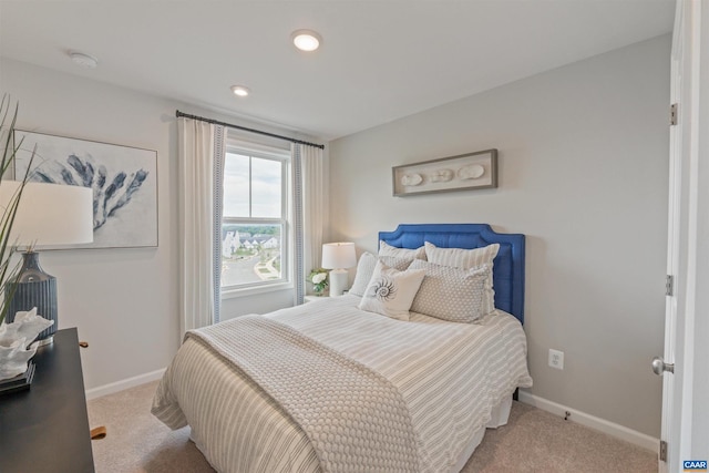 bedroom with light colored carpet