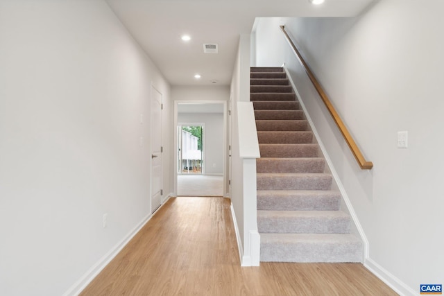 stairway featuring hardwood / wood-style flooring