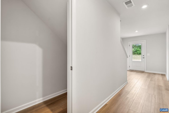 hall with light hardwood / wood-style floors