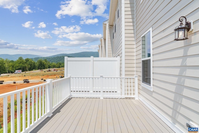 wooden deck featuring a mountain view