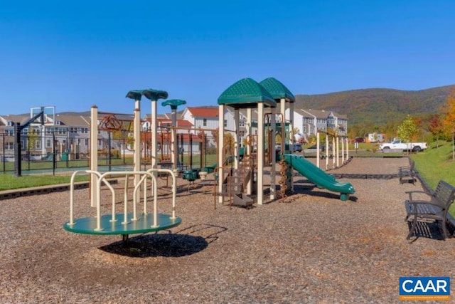 view of playground with a mountain view