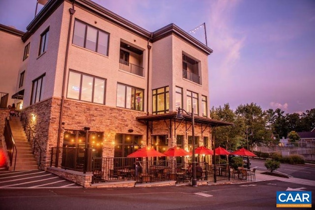 view of outdoor building at dusk