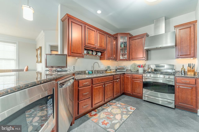 kitchen featuring stainless steel appliances, sink, wine cooler, wall chimney exhaust hood, and dark stone countertops