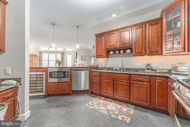 kitchen with stainless steel appliances, wine cooler, sink, pendant lighting, and vaulted ceiling