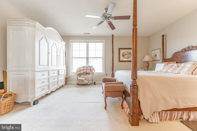 bedroom featuring ceiling fan and light carpet