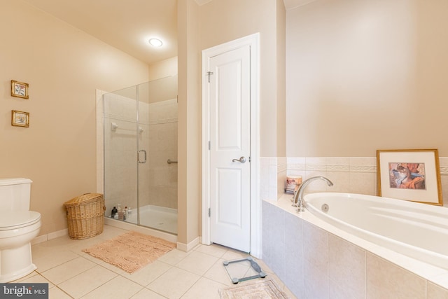 bathroom with tile patterned flooring, shower with separate bathtub, and toilet