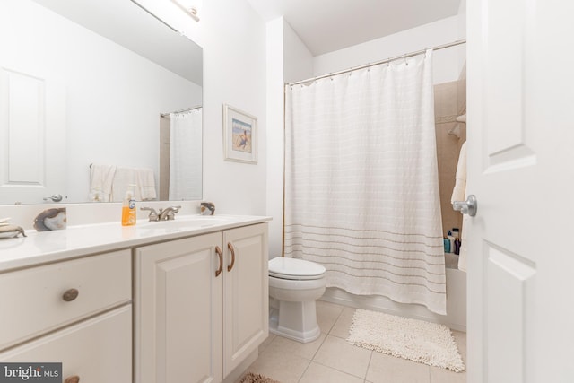 full bathroom featuring toilet, vanity, tile patterned floors, and shower / tub combo with curtain