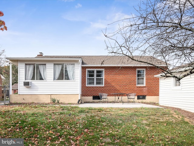 back of house with a patio area and a yard