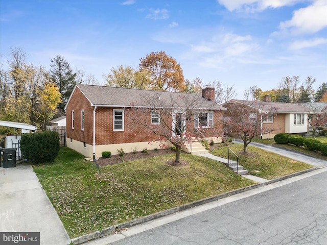 single story home with a front yard