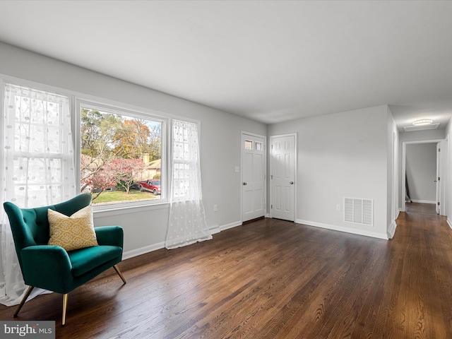 living area with dark wood-type flooring