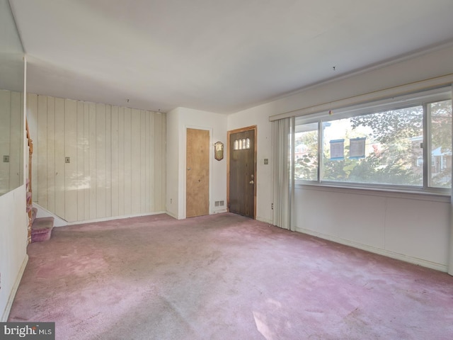 spare room featuring light colored carpet