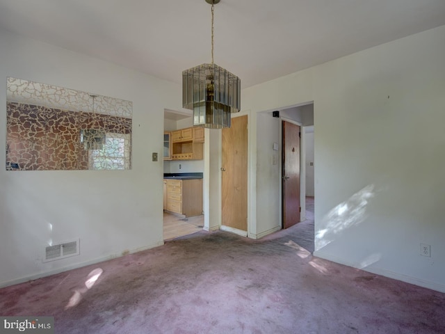 interior space featuring light colored carpet