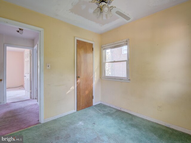 unfurnished bedroom featuring light carpet and ceiling fan