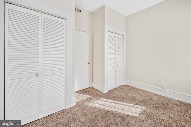 unfurnished bedroom with carpet