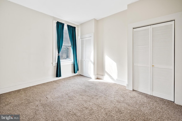 unfurnished bedroom with carpet