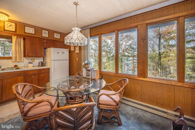 330 State Park Rd, Swanton, MD 21561 - dining room featuring a baseboard radiator and wood walls