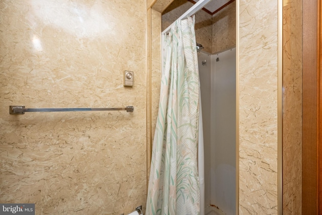 bathroom with a shower with curtain