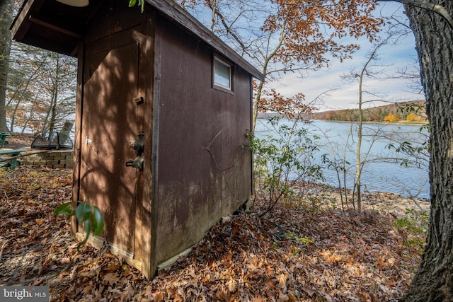 view of outbuilding with a water view