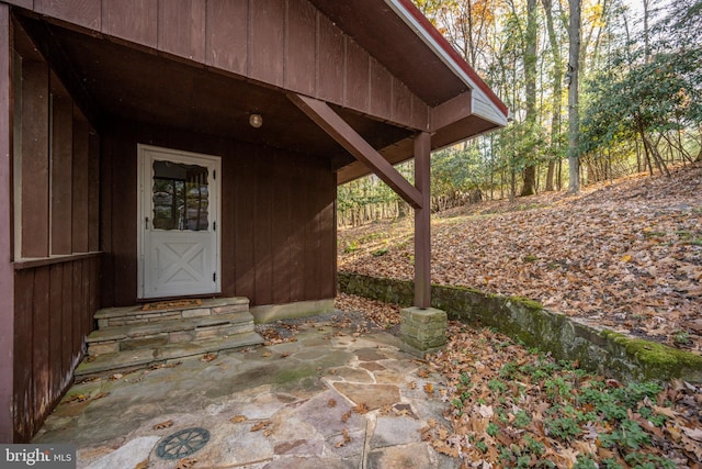 property entrance featuring a patio area