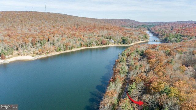 aerial view featuring a water and mountain view