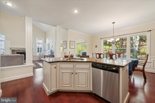 kitchen with a center island with sink, dishwasher, hanging light fixtures, and dark wood-type flooring