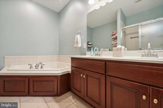 bathroom with vanity, lofted ceiling, shower with separate bathtub, and tile patterned flooring