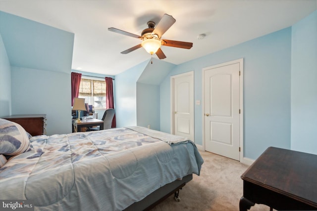 bedroom with light carpet, lofted ceiling, and ceiling fan