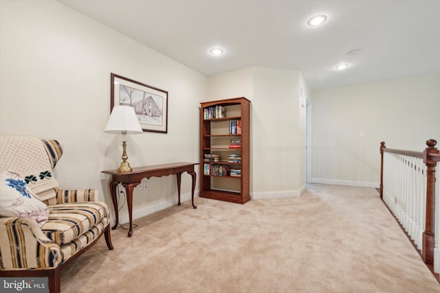 living area featuring light colored carpet