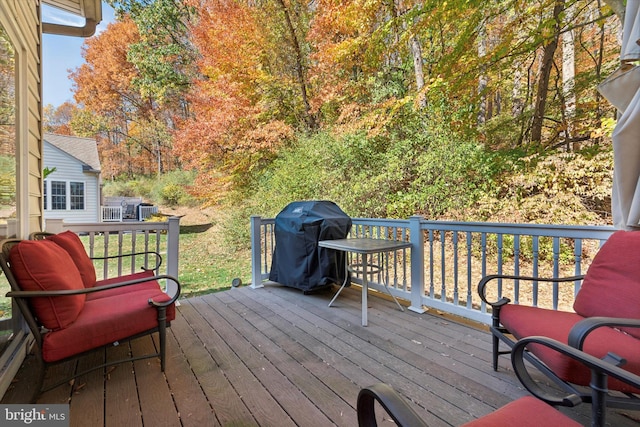 wooden deck with area for grilling