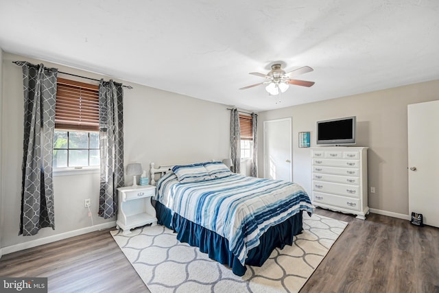 bedroom featuring hardwood / wood-style floors and ceiling fan