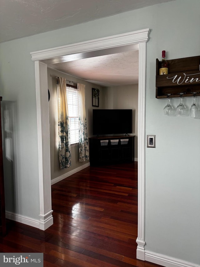 hall with dark hardwood / wood-style floors