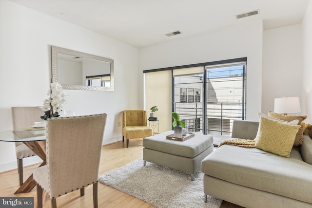 living room with light hardwood / wood-style floors