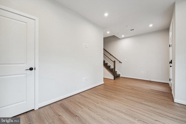 empty room with light hardwood / wood-style floors