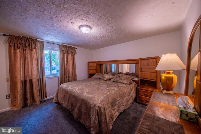 carpeted bedroom featuring a textured ceiling