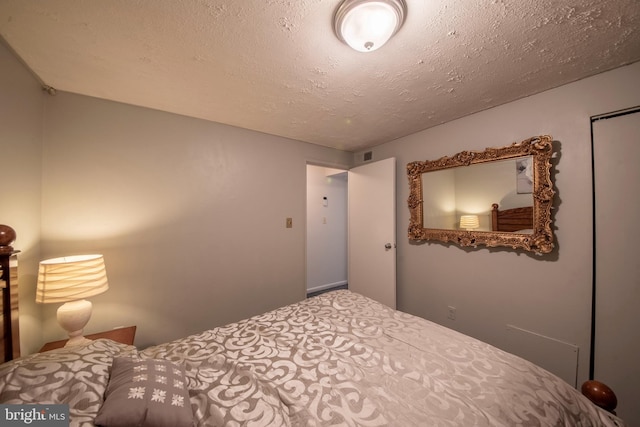 bedroom featuring a textured ceiling