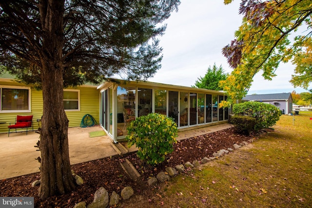 rear view of house with a patio