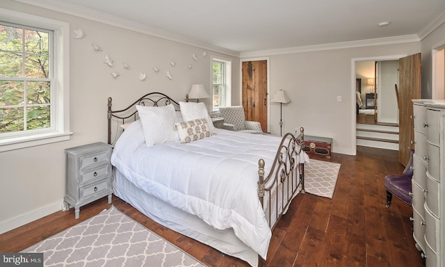 bedroom with ornamental molding and dark hardwood / wood-style flooring