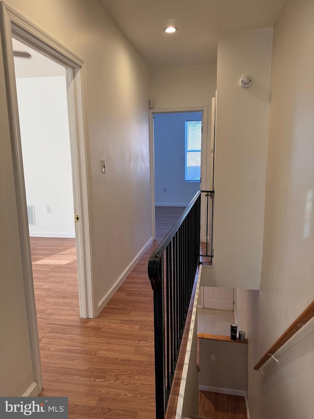 stairway featuring wood-type flooring