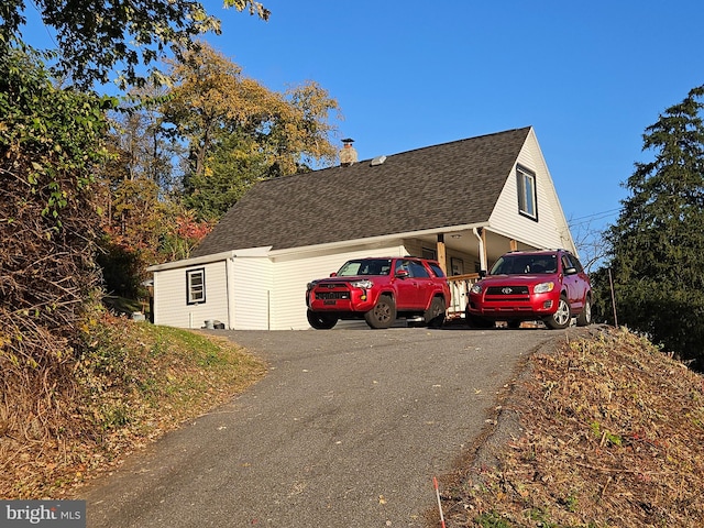 view of side of property with a garage