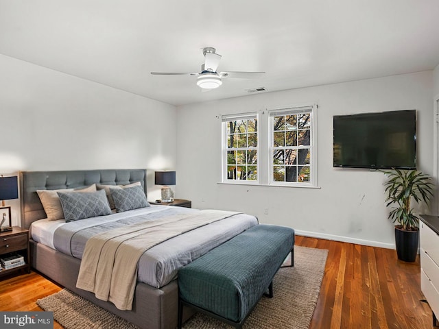 bedroom featuring hardwood / wood-style floors and ceiling fan