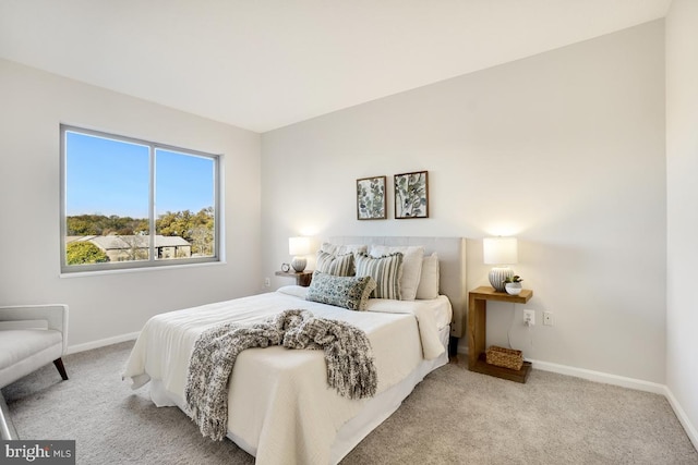 bedroom with light carpet