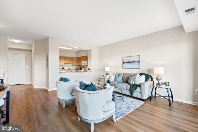 living room with hardwood / wood-style floors