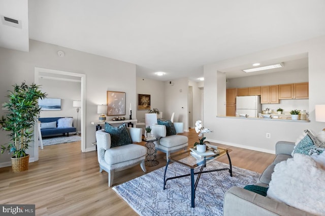 living room featuring light wood-type flooring