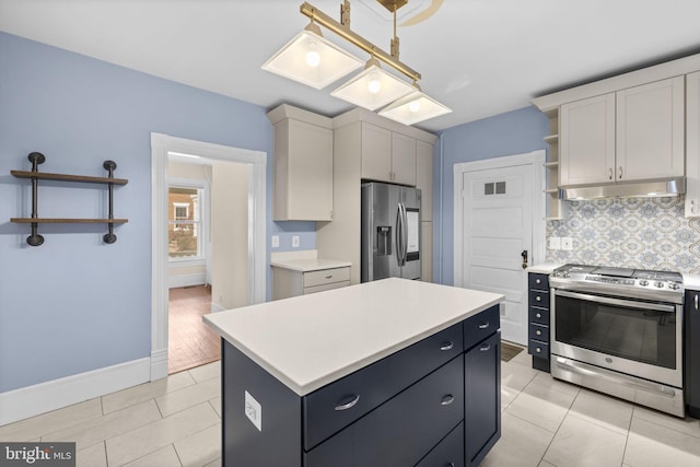 kitchen with stainless steel appliances, a kitchen island, white cabinets, light countertops, and open shelves