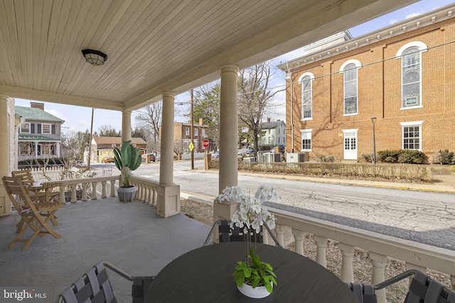 view of patio / terrace with covered porch and a residential view